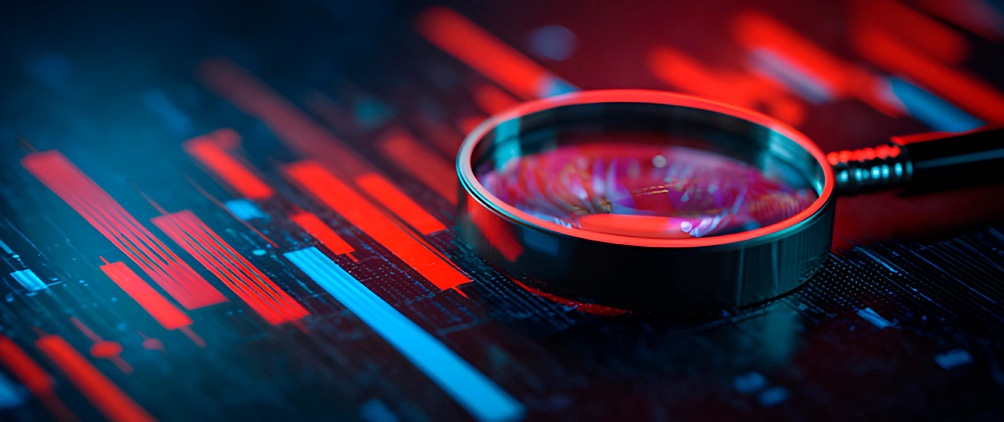 Magnifying glass over red and blue market charts representing fixed income analysis, economic data and market outlook.