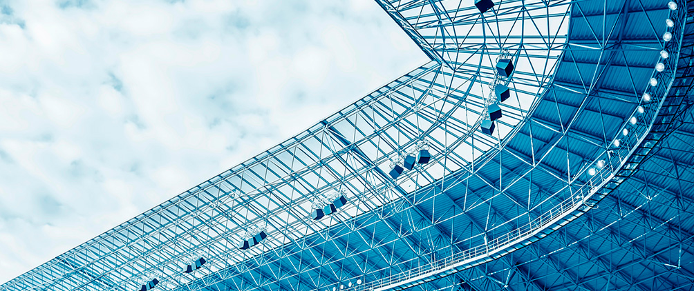 Blue-toned stadium roof representing sports infrastructure, private capital, stadium financing and year-round sports venue revenue opportunities.