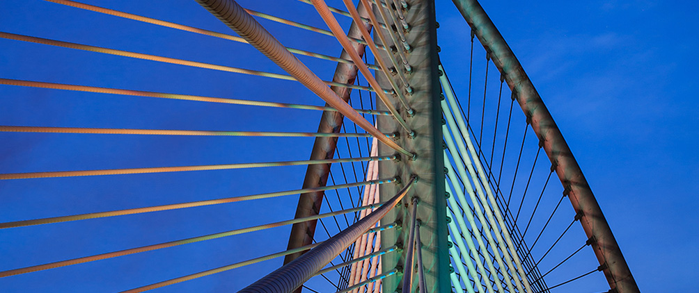 Bridge cables representing private credit strategies, portfolio structure and capital formation.