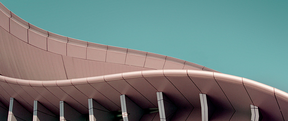 Curved modern building exterior representing opportunistic credit, structured capital, private markets and flexible financing solutions.