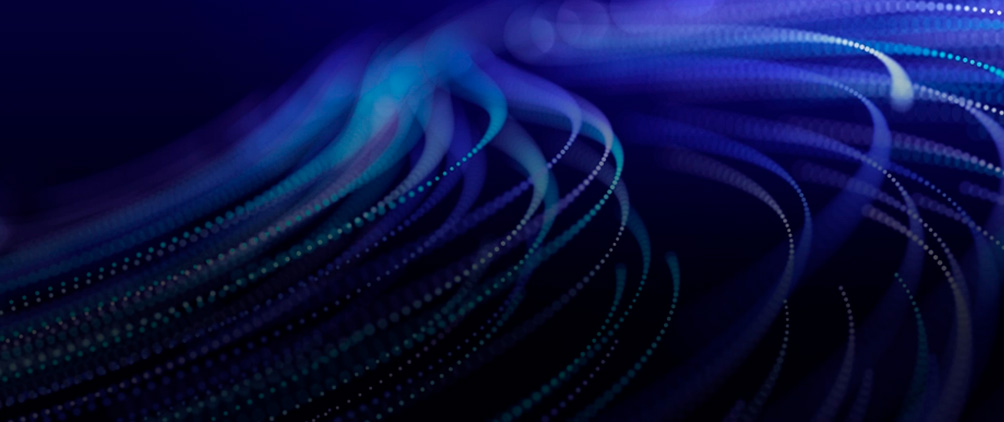Abstract blue digital light trails representing multi-asset investing, AI-driven growth, market volatility and portfolio diversification.