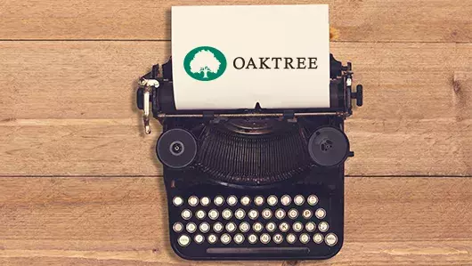 TYPEWRITER with Oaktree logo on a piece of paper