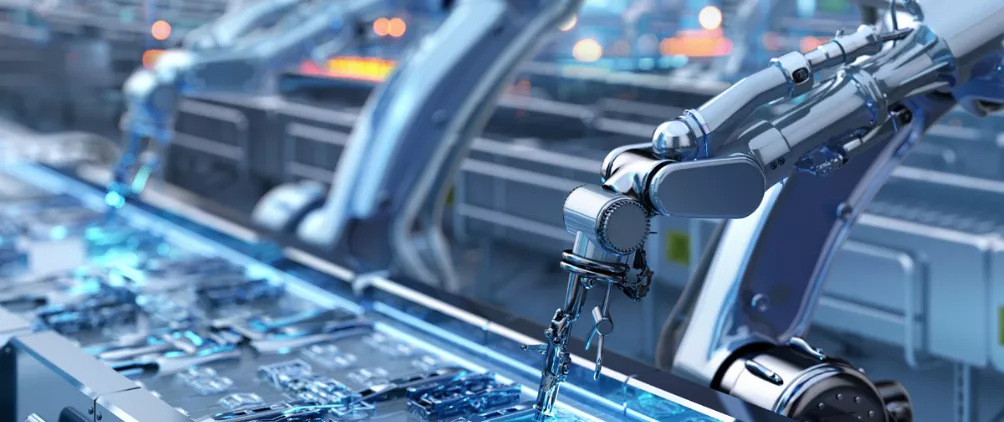 Robotic arms assembling electronic components on an automated production line in a high-tech manufacturing facility.