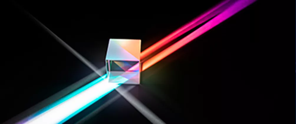 Abstract prism with colorful light beams representing Morgan Stanley Investment Management’s quantitative credit strategy model.