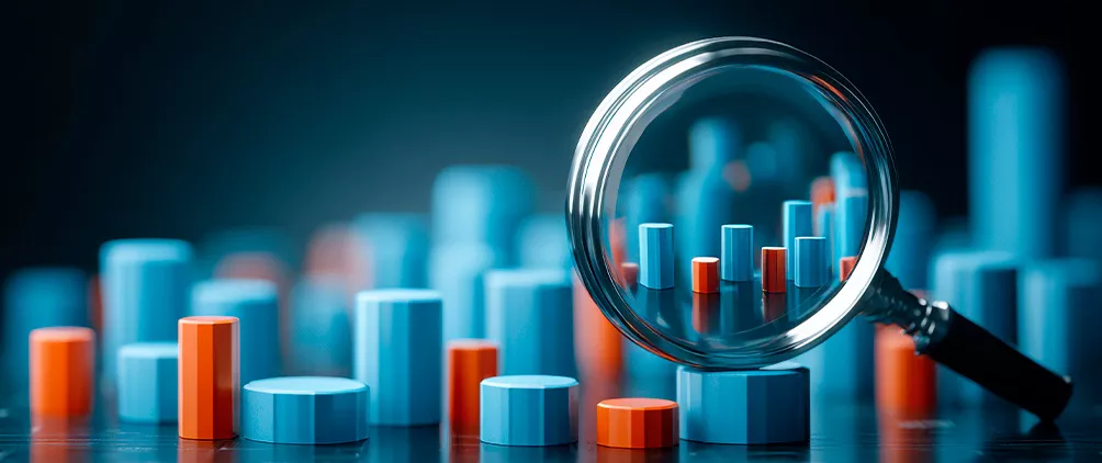 Magnifying glass over financial data columns representing insurer liquidity, funding strategy and FHLB capacity analysis.