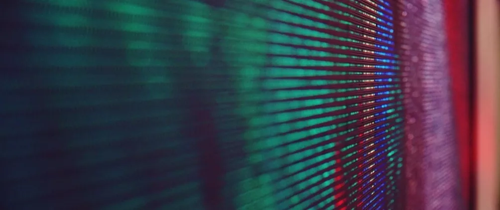 Colorful abstract digital texture representing private equity market trends, liquidity and AI-driven disruption.